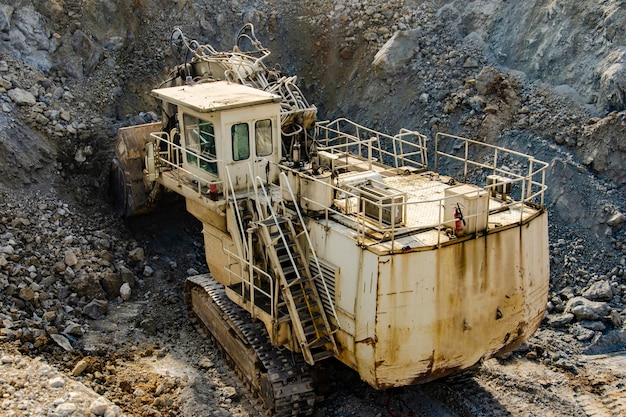 Excavator working in open pit machinery