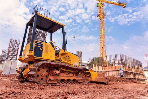 Excavator for working with earth and sand in sandpit in foundation work of the building 