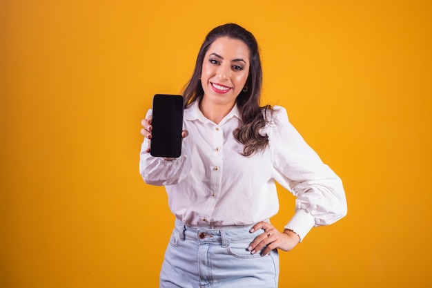 Excellent mobile offer. Woman with smartphone in her hand showing blank screen with space for text.