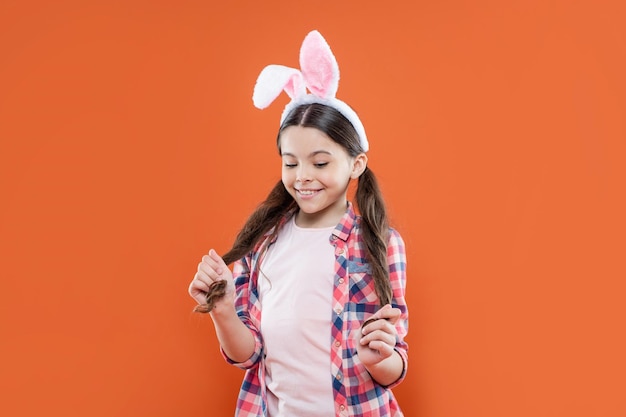 Excited about Easter time for fun adorable kid wearing funny hare ears spring holiday