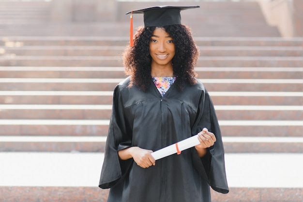 Excited African American woman at her graduation.