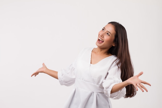 Excited asian woman looking up