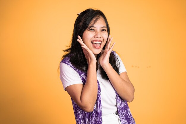 Excited beautiful woman feeling joy laughing on isolated background