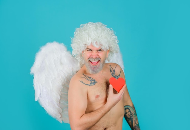 Excited cupid valentines day cupid angel with paper heart cupid in valentine day bearded cupid