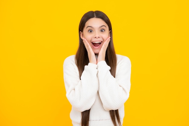 Excited face Amazed expression cheerful and glad Headshot portrait of teenager child girl isolated on studio background Childhood lifestyle concept Mock up copy space