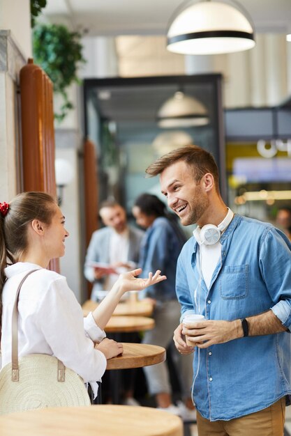 Excited friends drinking coffee