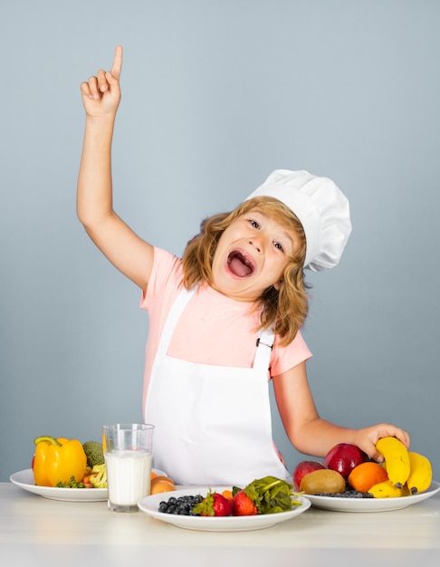 Excited funny chef cook child chef isolated on blue funny little kid chef cook wearing uniform cook