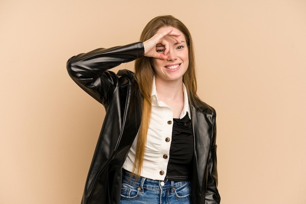 Excited keeping ok gesture on eye