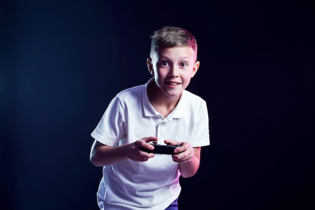 Excited kid playing video game in