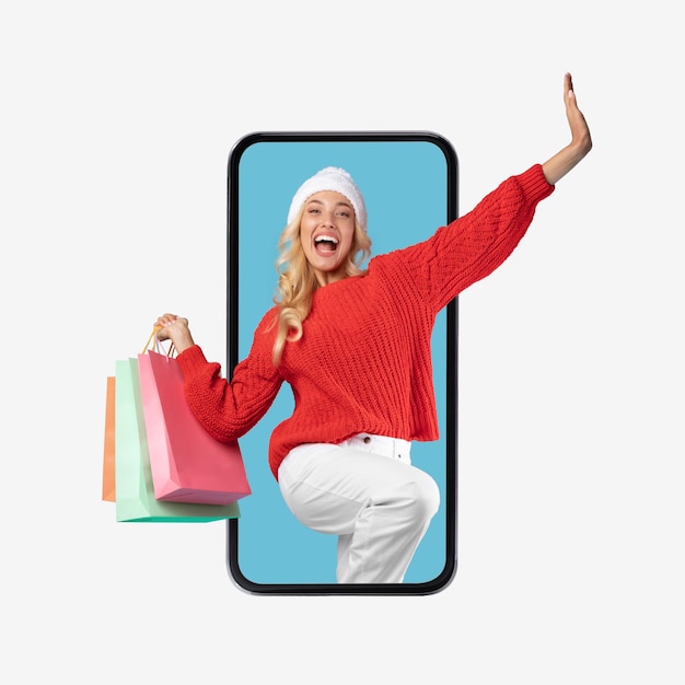 Excited lady looking out cellphone screen with shopping bags