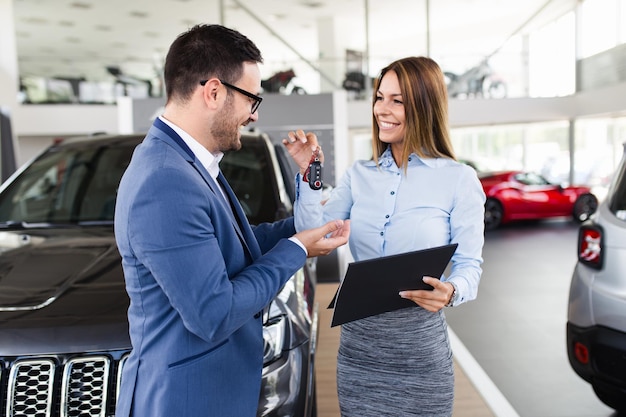 Excited man happy because of buying a new car.