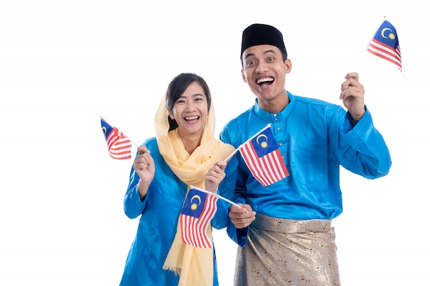 Excited muslim couple with malaysian flag