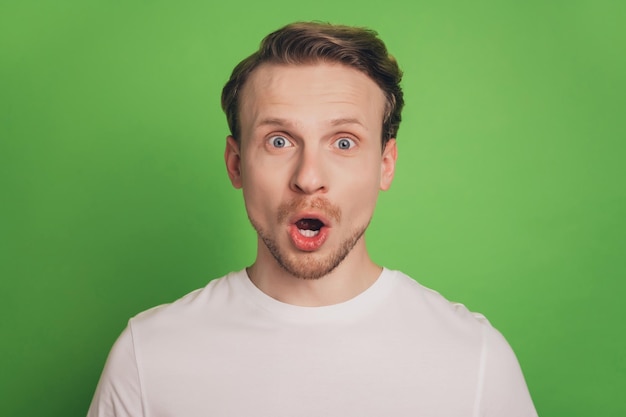 Excited shocked crazy funny blond man open mouth omg sale discount reaction isolated on green color background