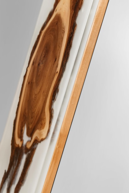 Exclusive handmade table of solid wood and epoxy resin on the background of wood boards