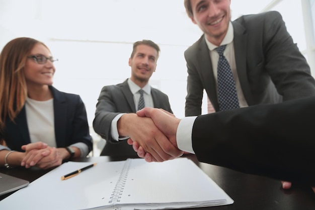 Executive and new hire member shaking hands