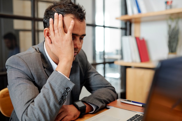 Exhausted businessman tired of work