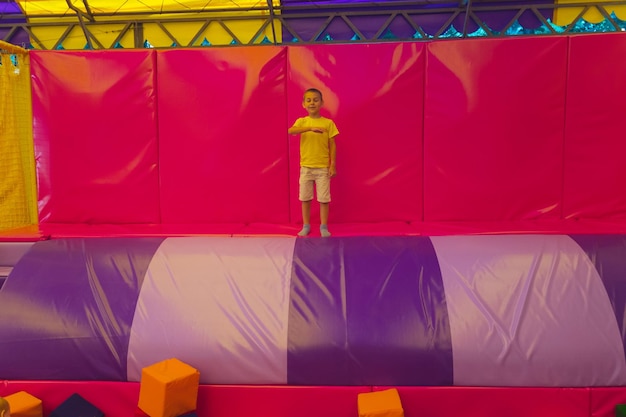 The exhausted and happy little boy in the trampoline park