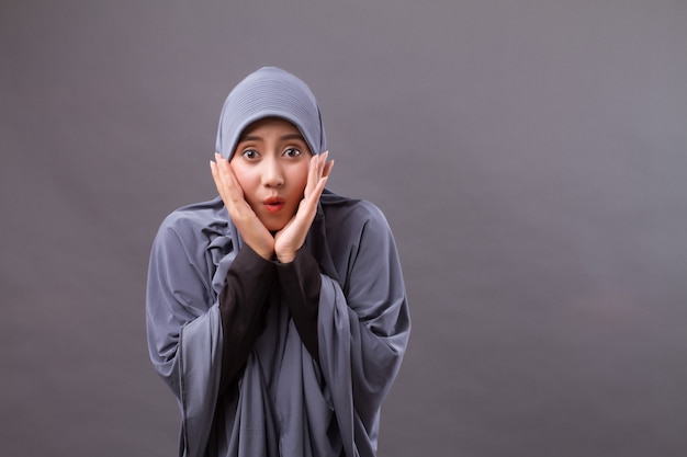 Exited, surprised muslim woman with hijab or head scarf