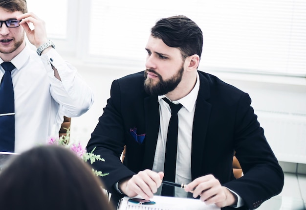 Experienced crisis Manager and business team conducted a working meeting in a modern office.the photo has a empty space for your text