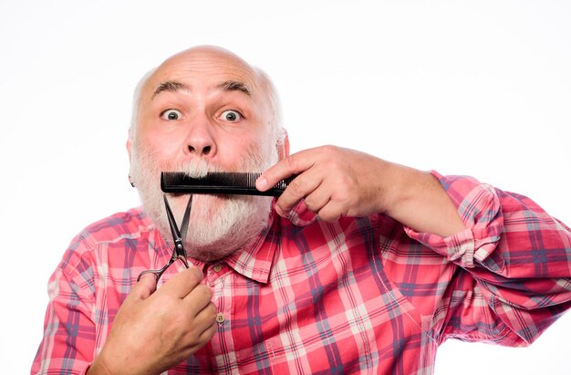 Expertise barbershop concept shaving accessories cut and brush hair mature bearded man isolated on white unshaven old man has moustache and beard shaving tool kit