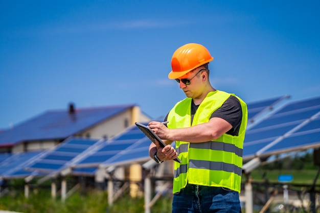 Expertise service worker on measuring efficiency of operation and maintenance at solar plant.