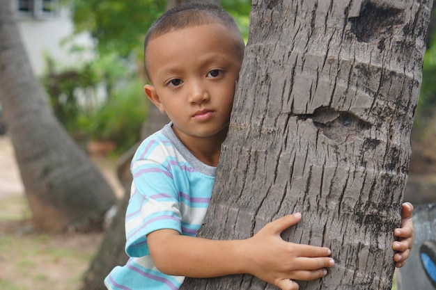 Explore the beauty of a happy boy in the garden through candid portraits capturing genuine joy and playfulness Experience the magic of childhood happiness