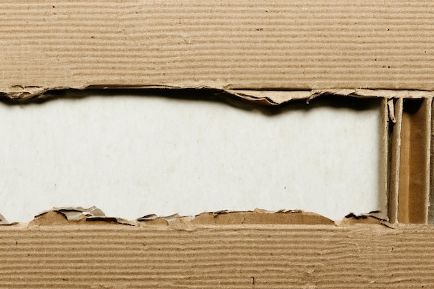 Photo exploring texture and depth the aesthetic impact of torn cardboard backgrounds