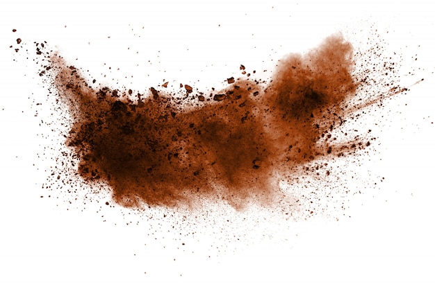 Explosion of deep brown powder on white background.