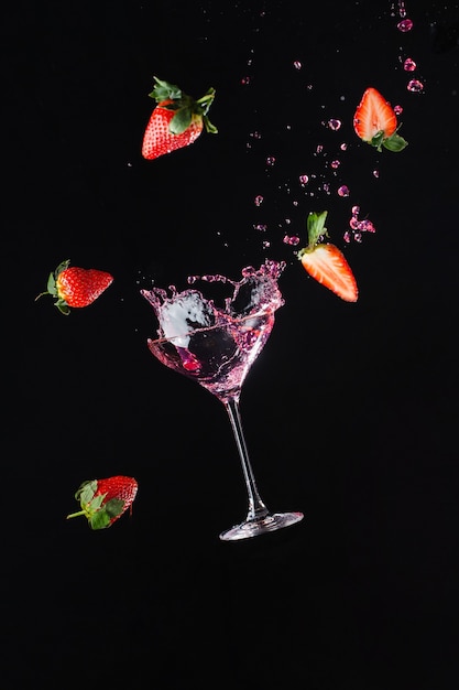 Explosion of freshness with a cool glass of wine. Black background