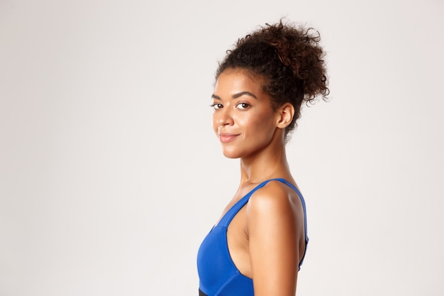 Expressive woman in fitness clothing posing