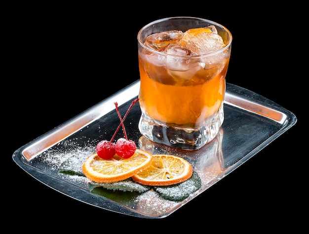 Exquisite cocktail with citrus chips on a tray Dark background