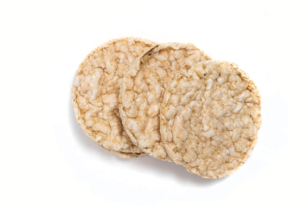 Exquisite round rice crackers on a white surface Copy Space Healthy eating