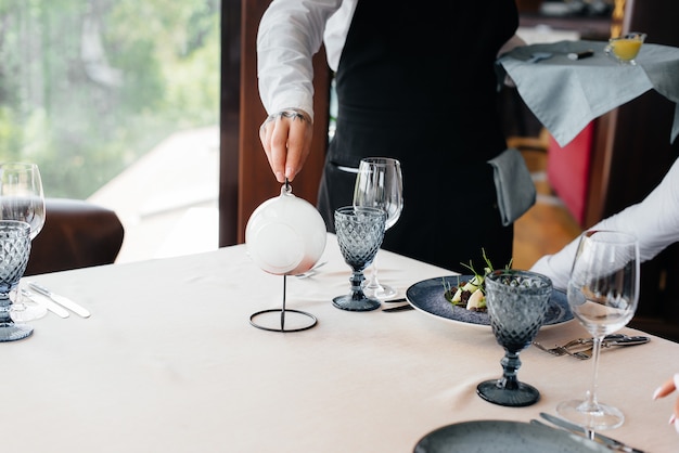 An exquisite salad of seafood, tuna and black caviar in a beautiful serving on the table in the restaurant. Exquisite delicacies of haute cuisine close-up.