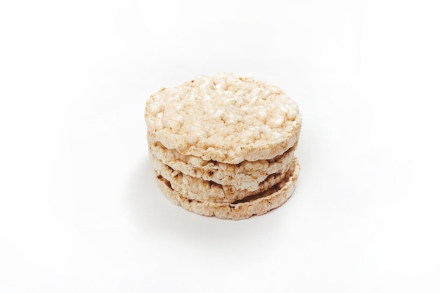 Exquisite stack of round rice crackers on a white surface Copy Space Healthy eating