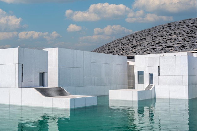 Exterior of Louvre Abu Dhabi famous museum View of Louvre showing Rain of Light Dome