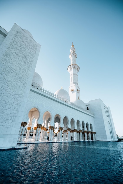 exterior view huge white mosque with high white tower