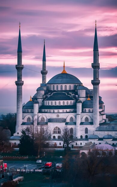 Exterior view of the large white mosque and the tall white tower