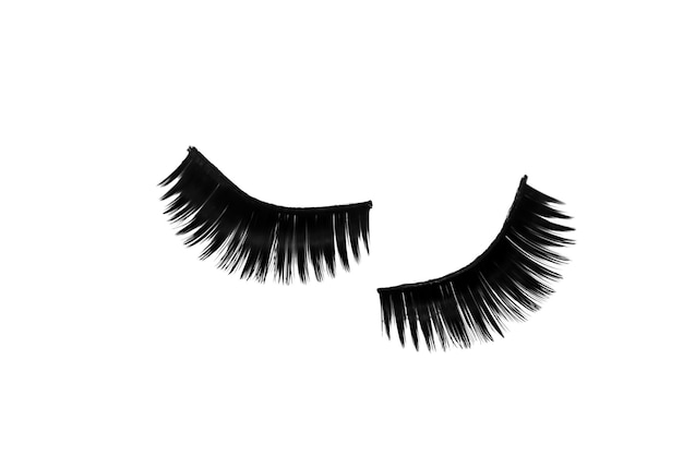 Extra long artificial black eyelashes isolated on white background Top view