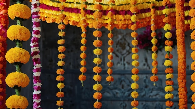 Extravagant decorations of marigold garlands in vibrant colors hanging prominently