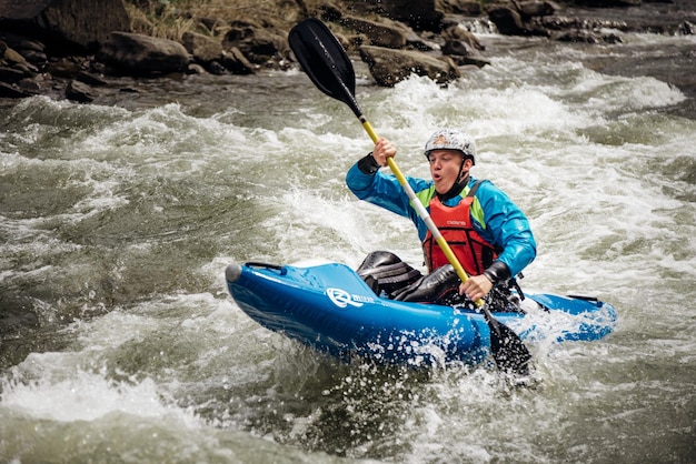 Extreme  rafting  A one person in kayak practise traversing the water rapids Kayaking concept