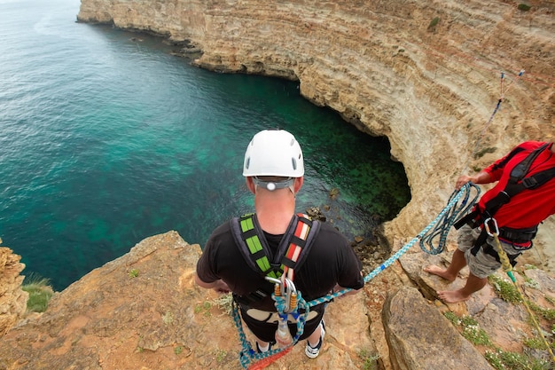 An extreme sportsman jumps on a rope from a great height Rope jumping