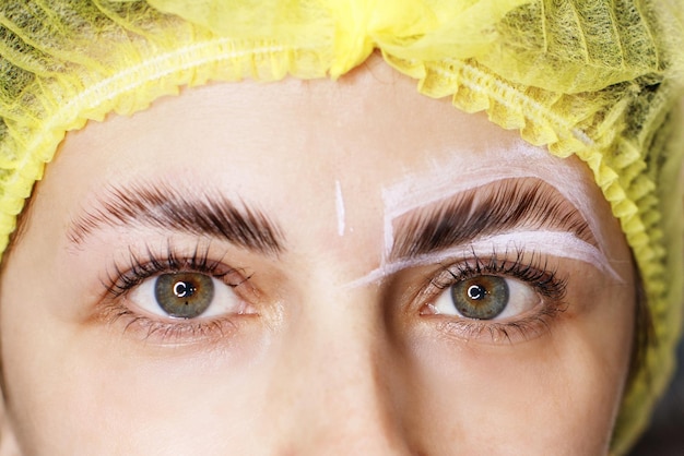 Eyebrow shape correction closeup of a woman