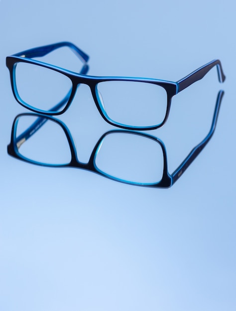 eyeglasses on blue