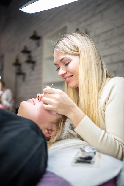 Eyelash extension procedure in beauty salon lashes close up concept spa lash