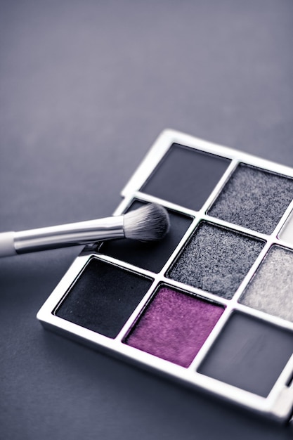 Eyeshadow palette and makeup brush on graphite background eye shadows cosmetics product for luxury beauty brand promotion and holiday fashion blog design