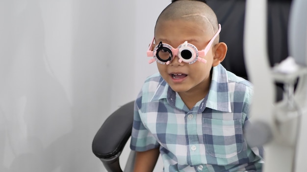 Eyesight check. Asian boys who have vision disabilities