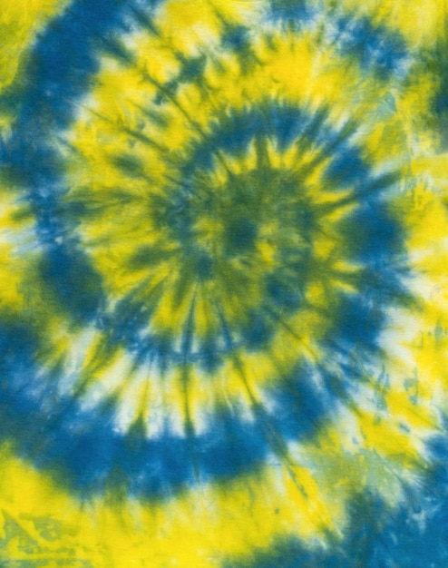 The fabric is painted in yellow and blue colors in tie dye style Flat lay