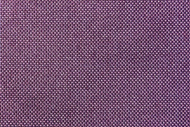 The fabric is purple in color. Top view, fabric texture.