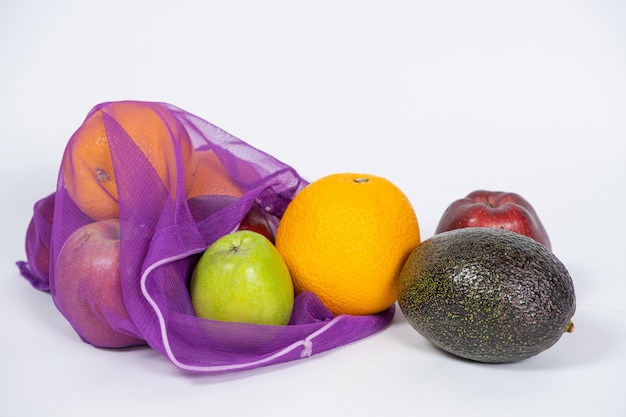 Fabric mesh for fruits and vegetables on a white background