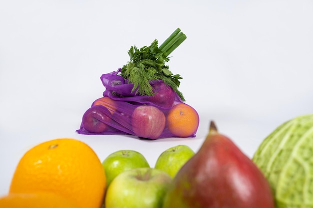 Fabric mesh for fruits and vegetables on a white background